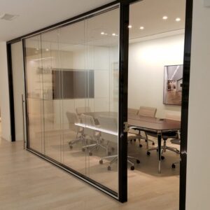 Framed-Glass-wall-partions-with-anodized-reveal-with-pivot-framed-door-and-sliding-frameless-door-1024x576