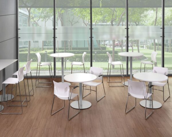 White Tela Bistro Stools and Tela Guest chair with Arms Arraigned around White Circular Tables