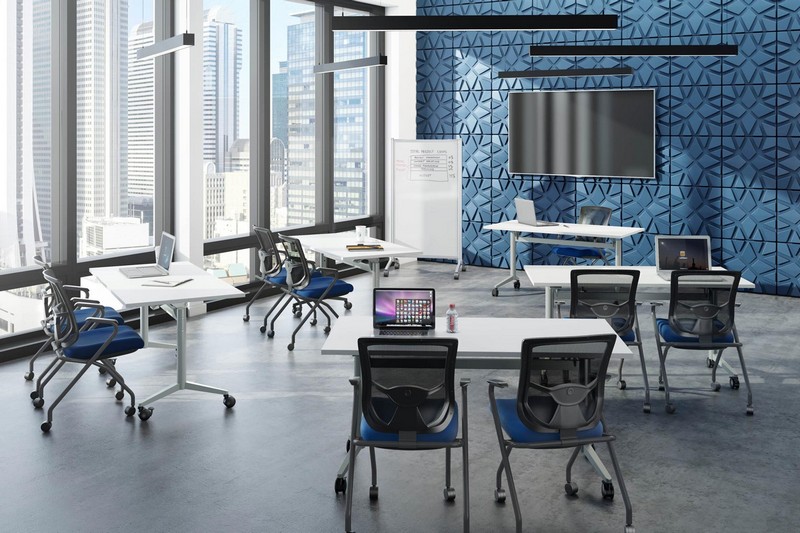 Coolmesh Pro Nesting Chairs with Blue seats with flip tables in a training room. SKU 8094